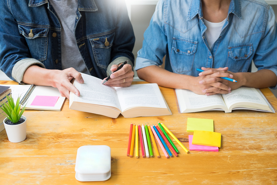 students-studying-spanish-with-books