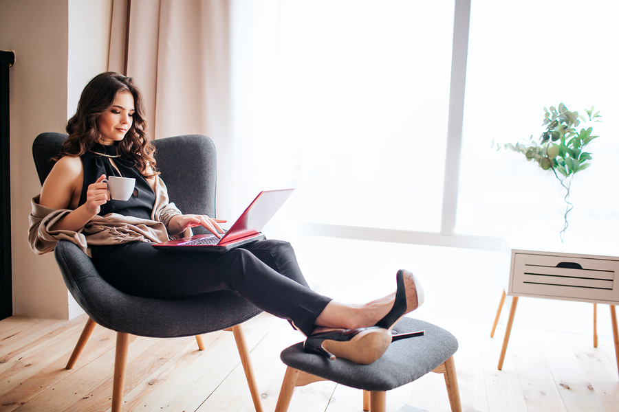 businesswoman-reading-from-her-laptop