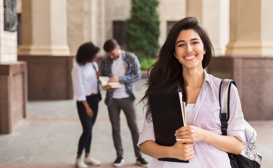 happy-year-abroad-student-at-university-holding-files