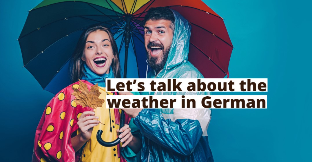 A man and a womand standing under an umbrella smiling about German weather words and phrases