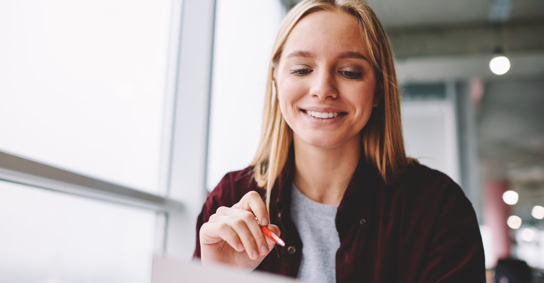 woman looking at how to build her cv resume in english