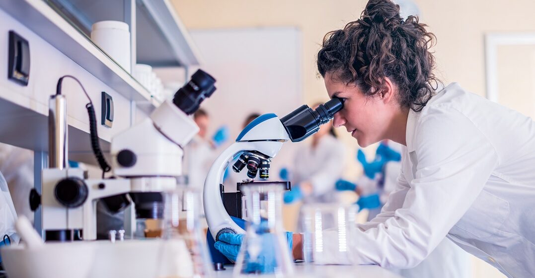 Young woman in a lab doing a PhD in Germany