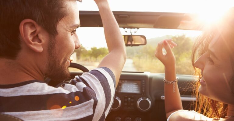 Couple singing German love songs in the car