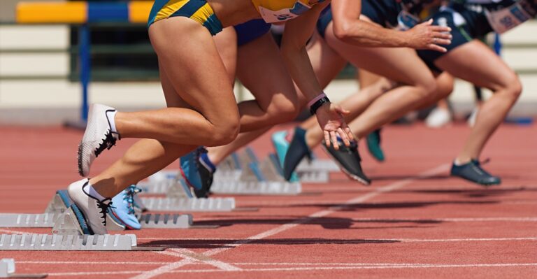 Group,Of,Female,Track,Athletes,On,Starting,Blocks