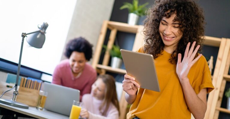 Young woman with an iPad taking one of the best online French classes